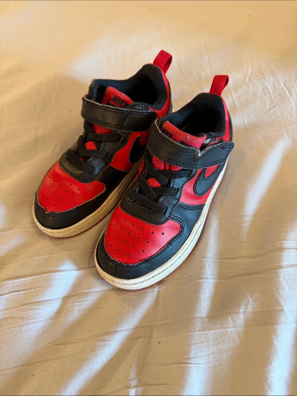 Nike's Kids Black and Red Athletic Sneakers with Hook-and-Loop Strap